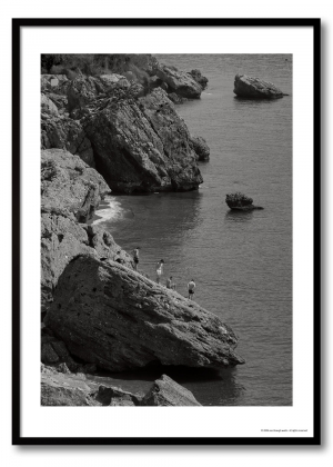 Mediterranean coast photography print showing four figures on limestone rocks above a calm sea, monochrome coastal observation